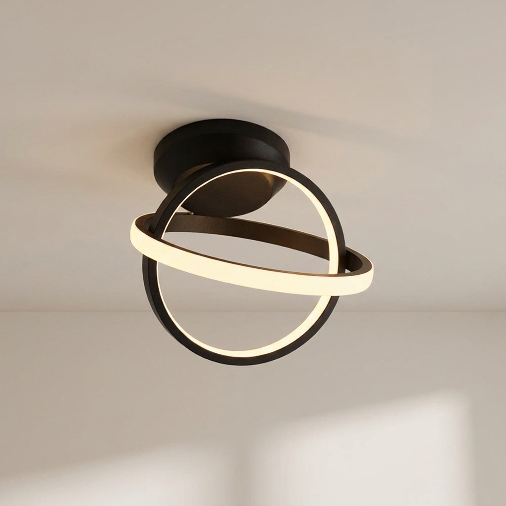 Modern ceiling light fixture with black and gold design on a neutral ceiling.