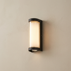 Modern wall-mounted light fixture on a beige wall