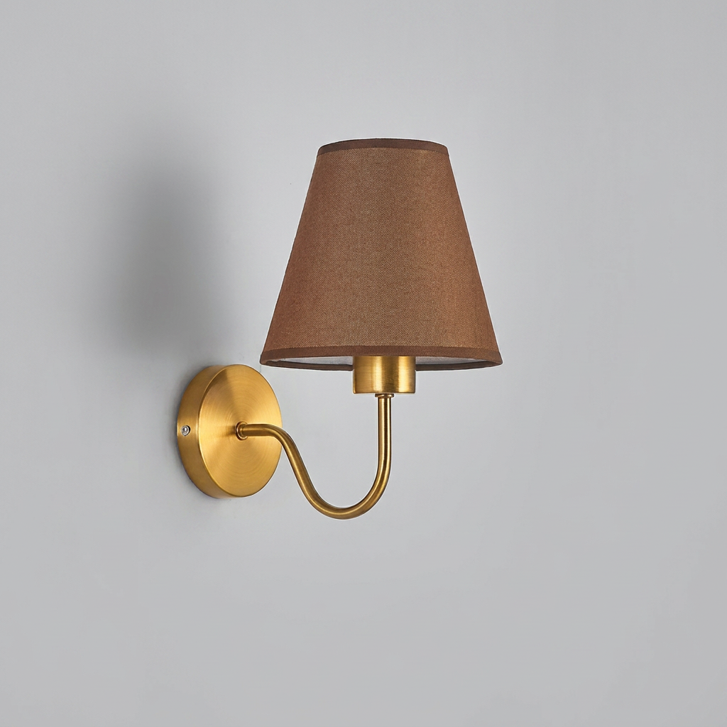 Wall-mounted lamp with brown shade and gold arm on a gray background