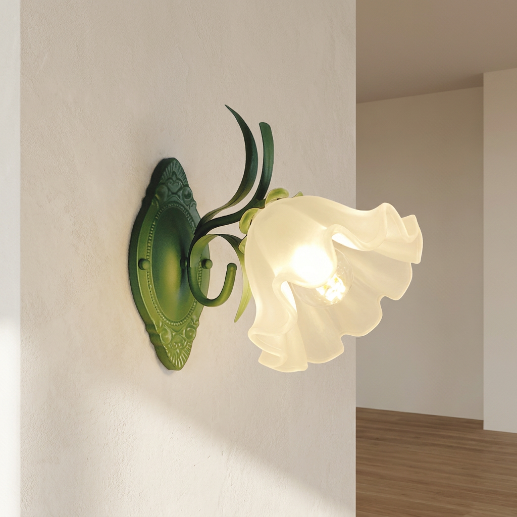 Decorative wall light fixture with green metal and white glass shade on a plain wall.