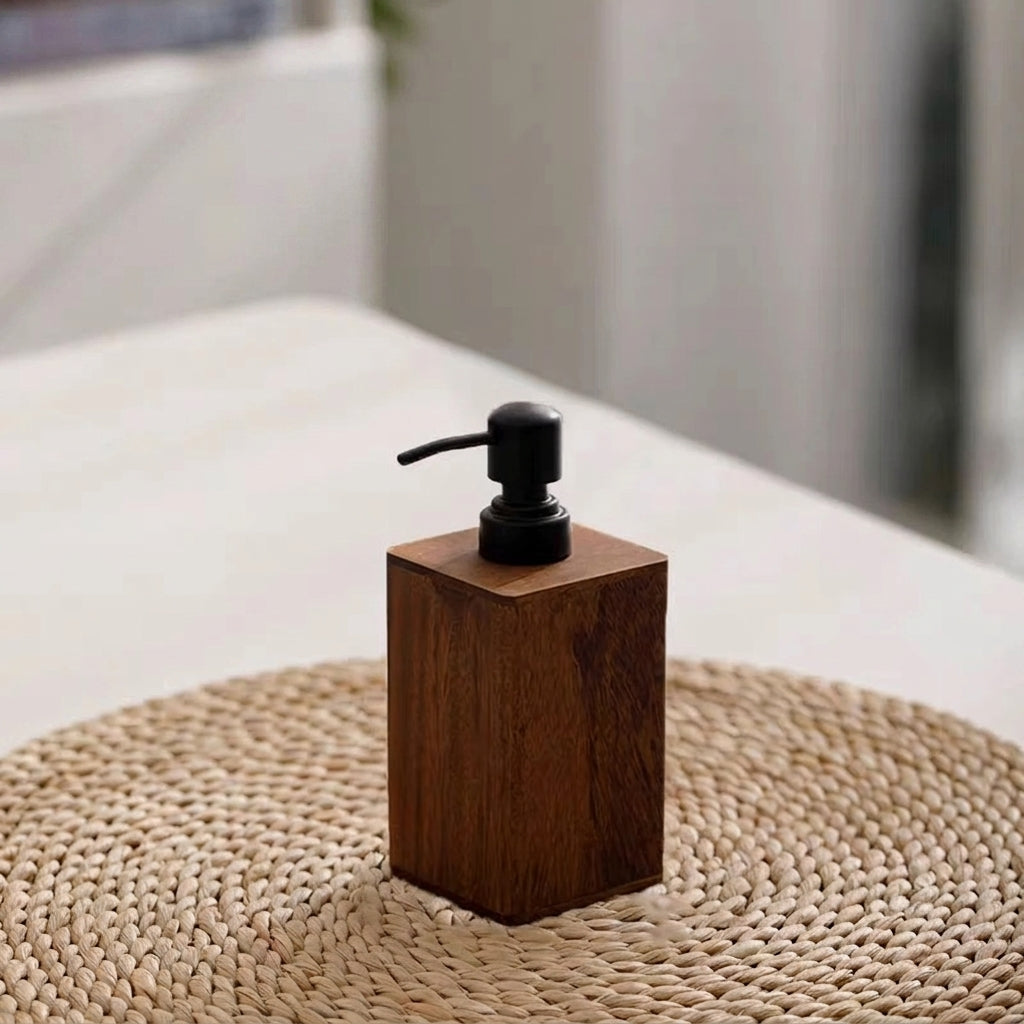 Wooden soap dispenser on a woven mat with a blurred background