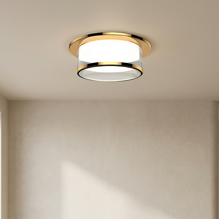 Ceiling light fixture in a minimalistic room with neutral walls and floor.