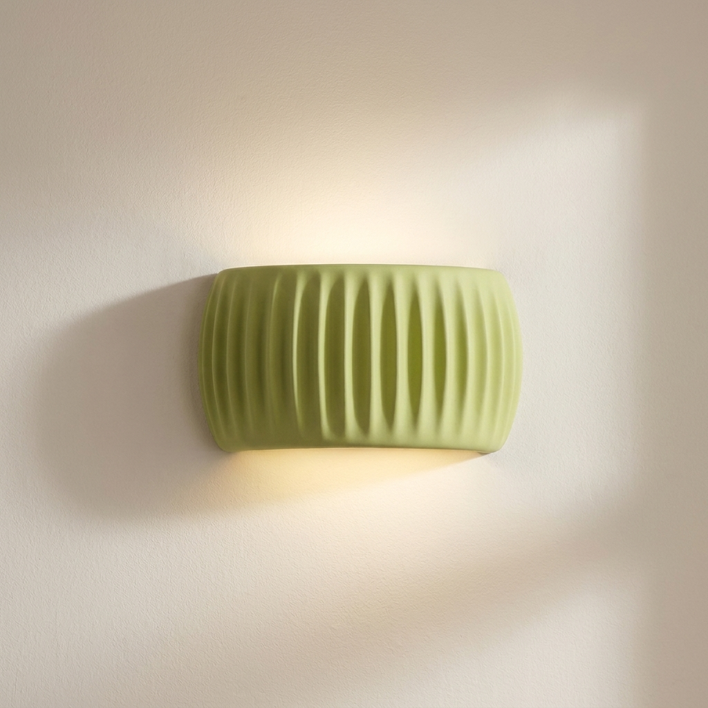 Green wall-mounted light fixture on a beige wall