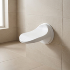 White grab bar mounted on a tiled bathroom wall