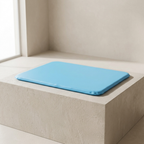 Blue bath mat on a stone ledge with a neutral background