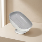 Gray pet dish on a beige surface with a neutral background