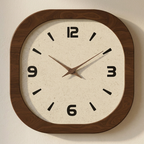 Wall clock with wooden frame and beige face on a light background