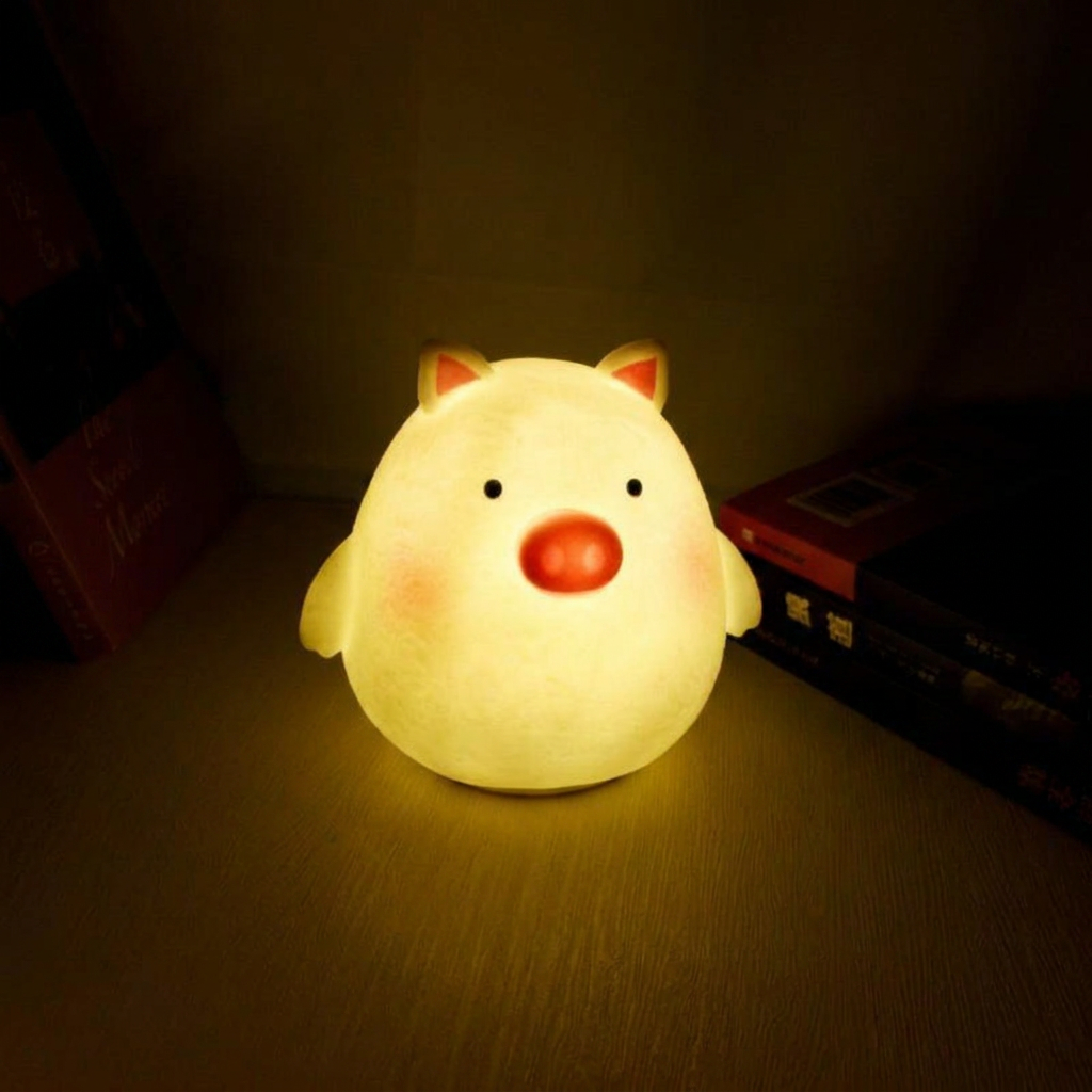 Cute animal-shaped night light on a dark surface