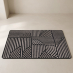 Geometric patterned doormat on a plain floor