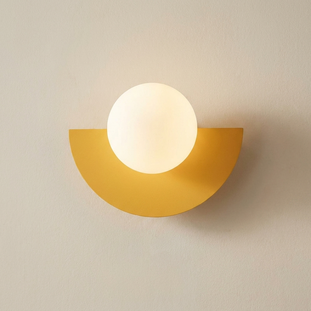Yellow wall sconce with a white bulb on a beige wall