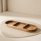 Wooden tray with three compartments on a beige surface