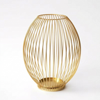 Gold wire basket on a white background