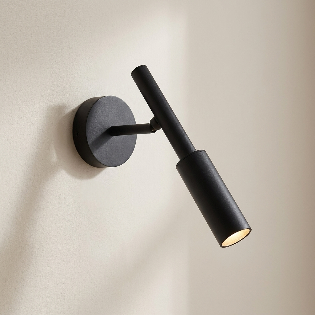 Black wall-mounted light fixture on a beige background