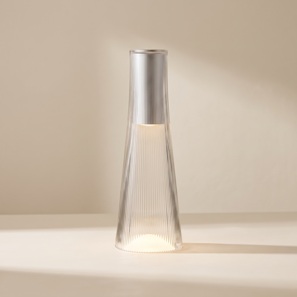 A modern ribbed glass floor lamp with a silver metallic collar, shown lit on a minimalist beige background.