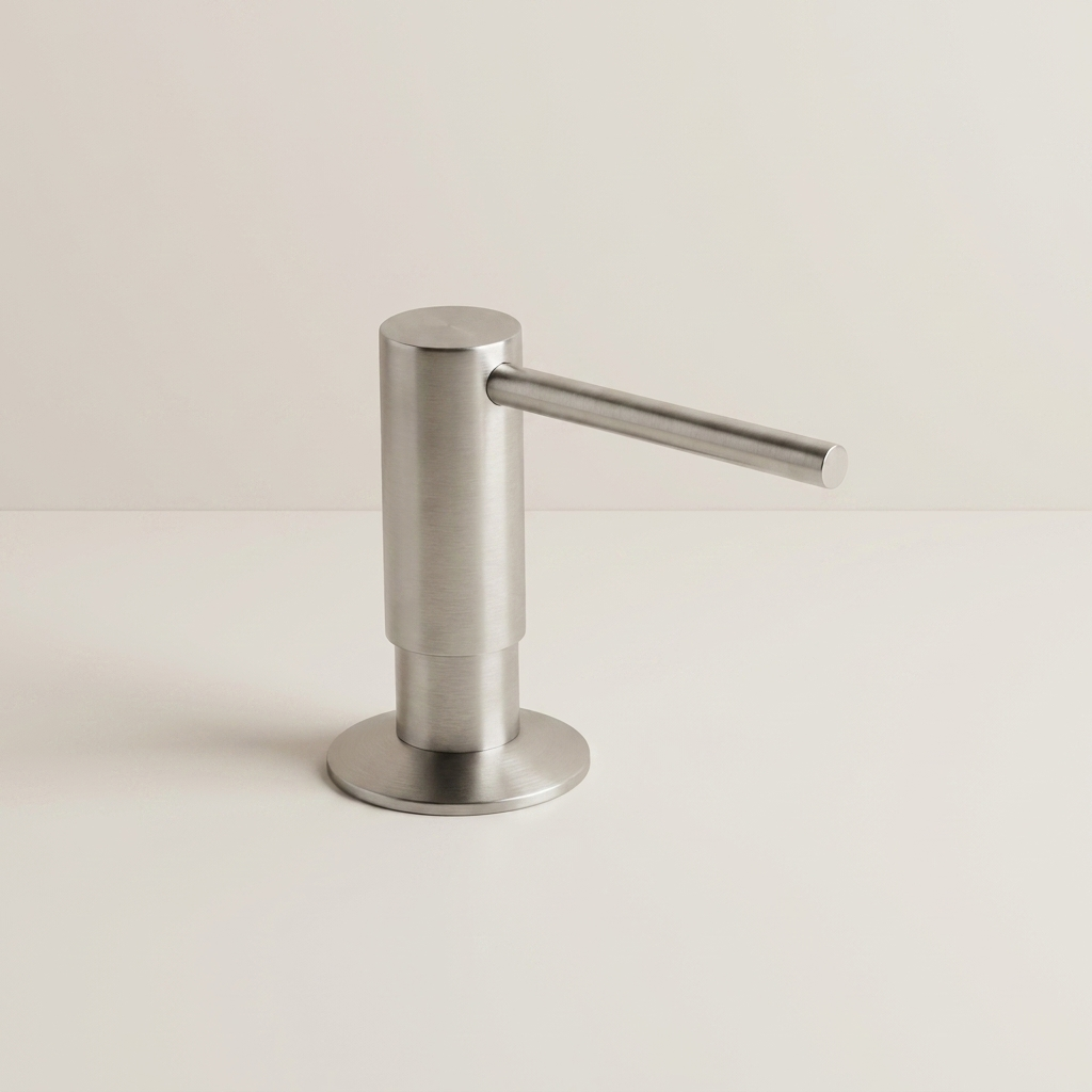 A modern stainless steel countertop dispenser with a cylindrical body and a flat horizontal spout, shown on a clean off-white background.