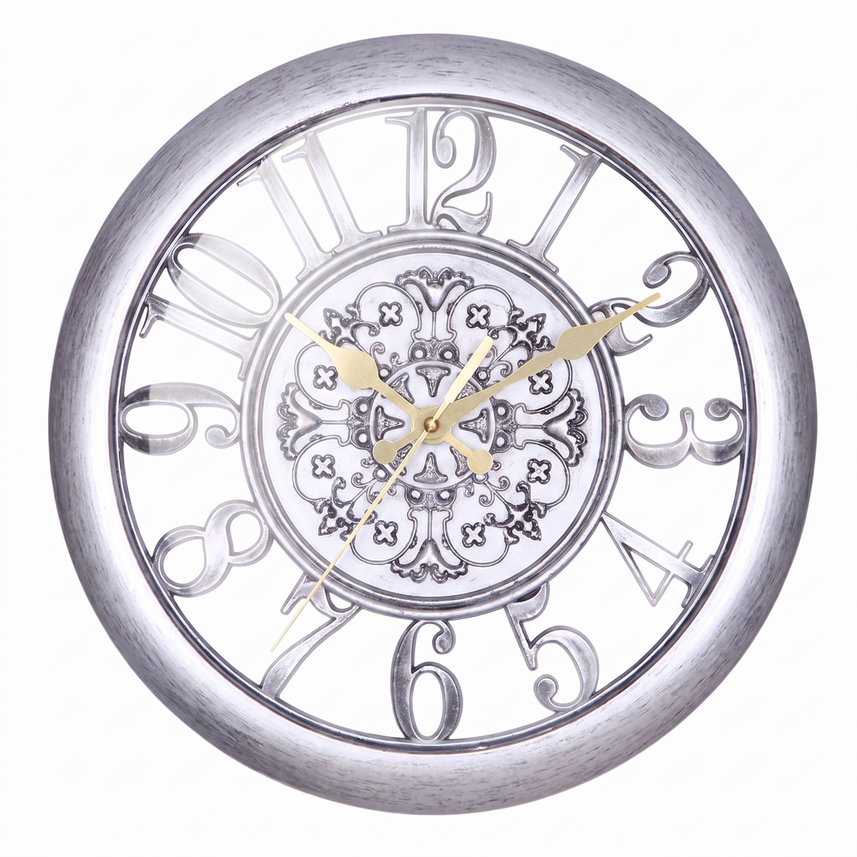 A round wall clock with a distressed silver metal frame and a white face featuring large decorative serif numerals and a central ornate floral pattern. The clock has gold-tone hands.