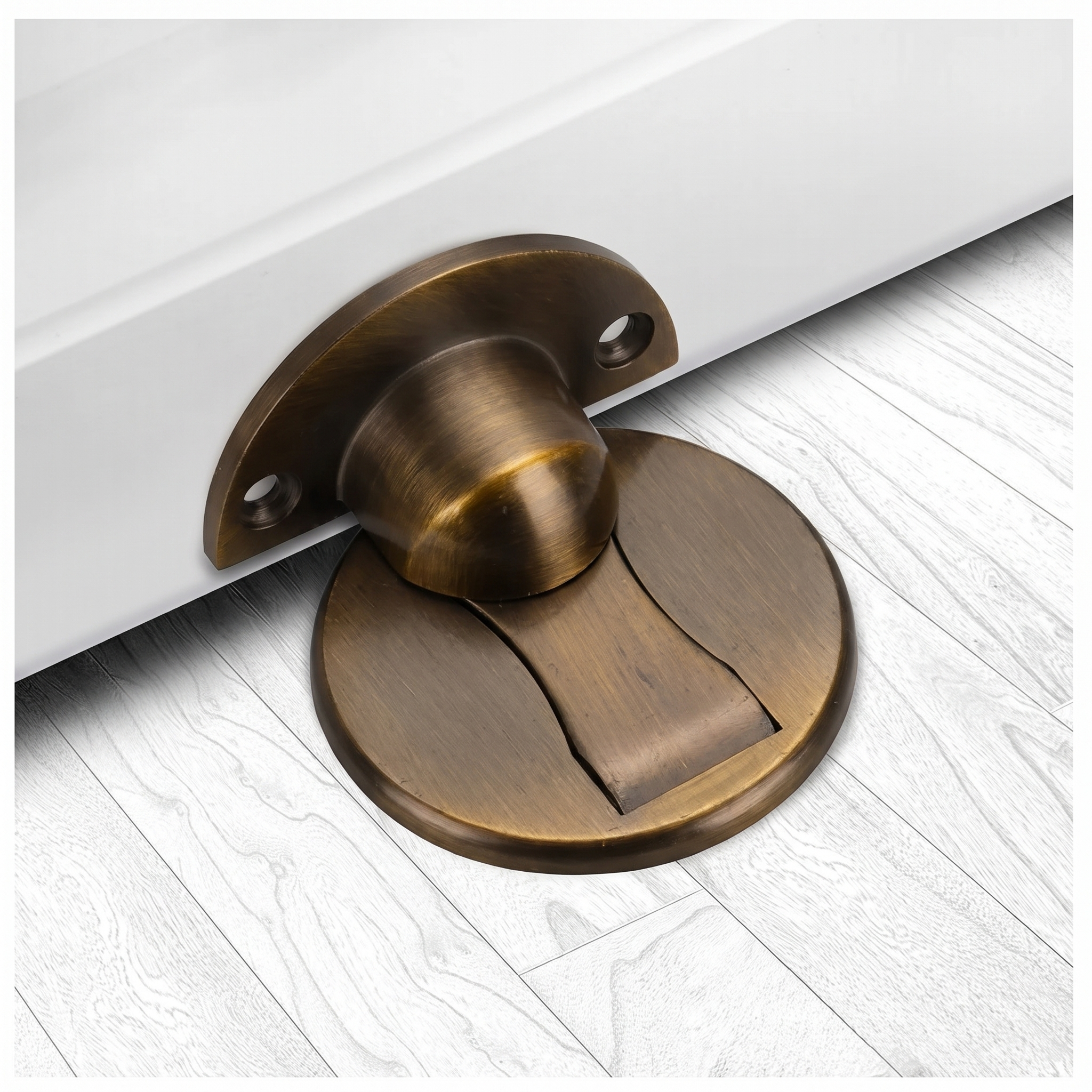 An antique bronze door stopper mounted on a white door, resting on a light gray wood-look floor.