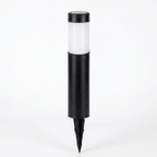 A modern solar-powered outdoor ground stake light with a matte black cylindrical body, a frosted white light panel, and a pointed stake, shown on a seamless white background.