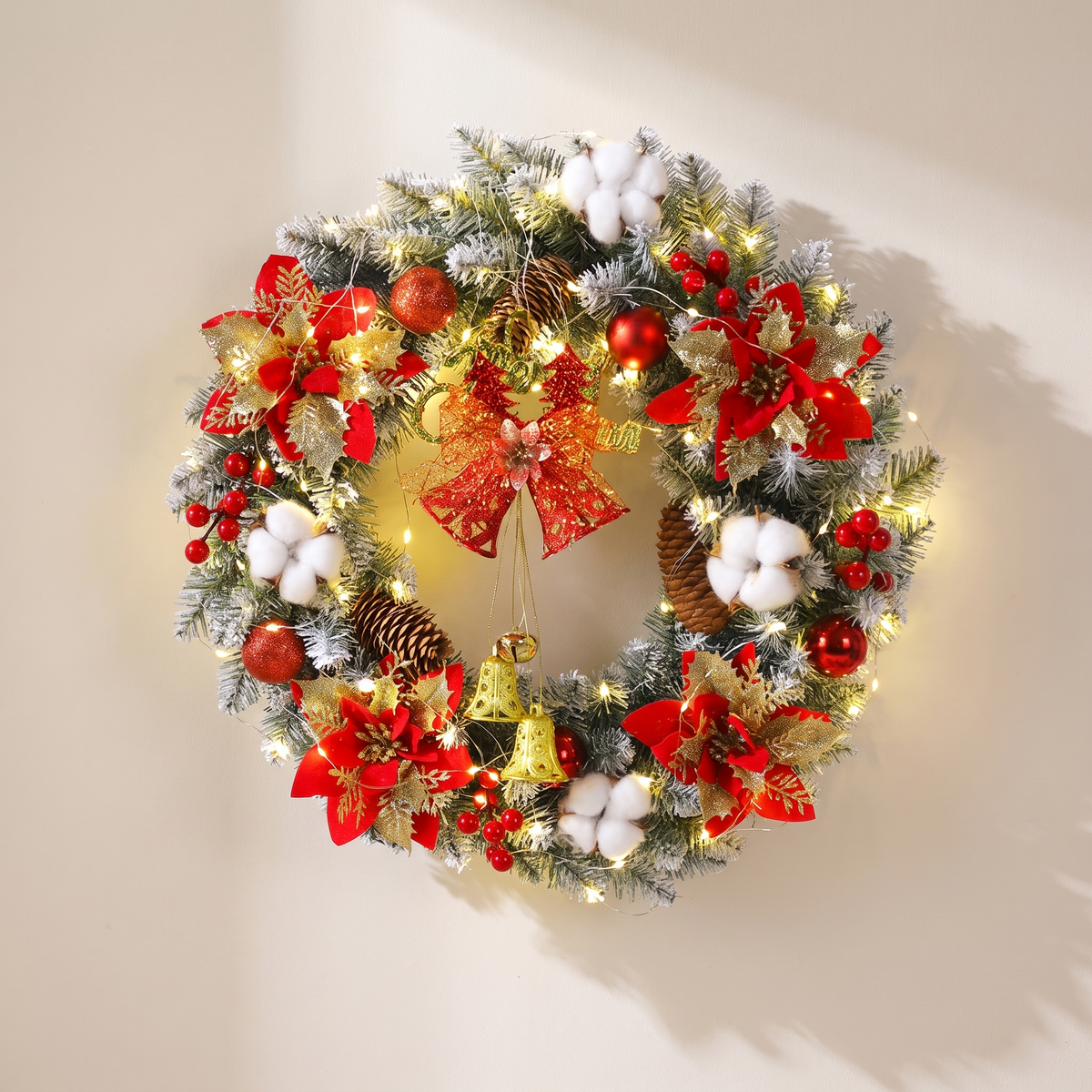 Christmas Wreath with Golden Poinsettias Bells and Pine Cones