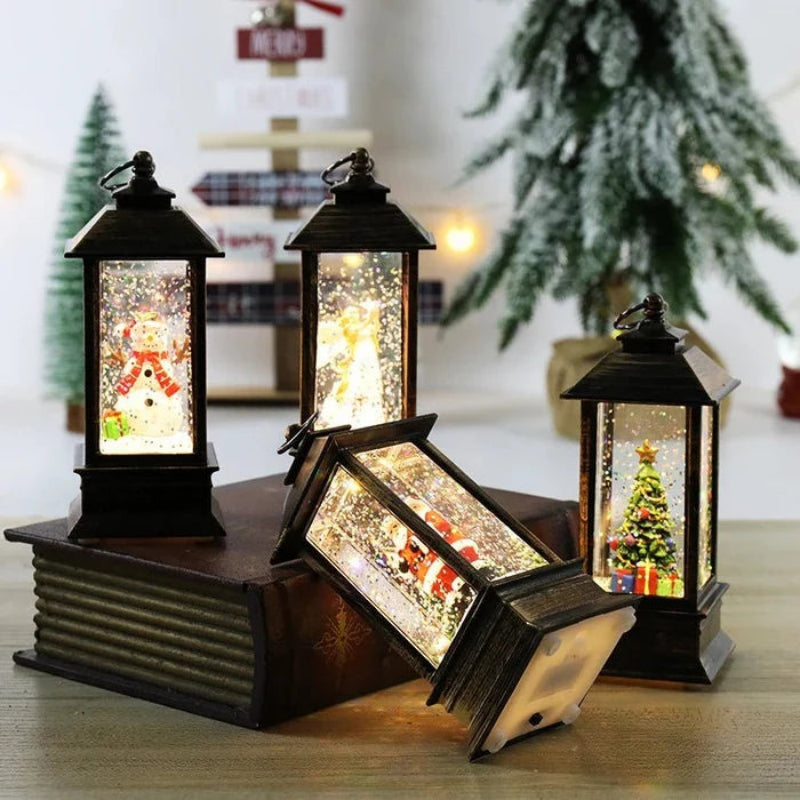 Set of decorative lanterns with Christmas scenes inside on a wooden surface.