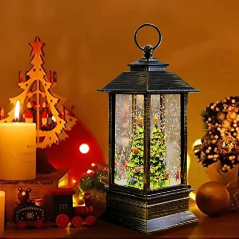 Decorative lantern with Christmas scene inside, surrounded by festive items on a warm-toned background.