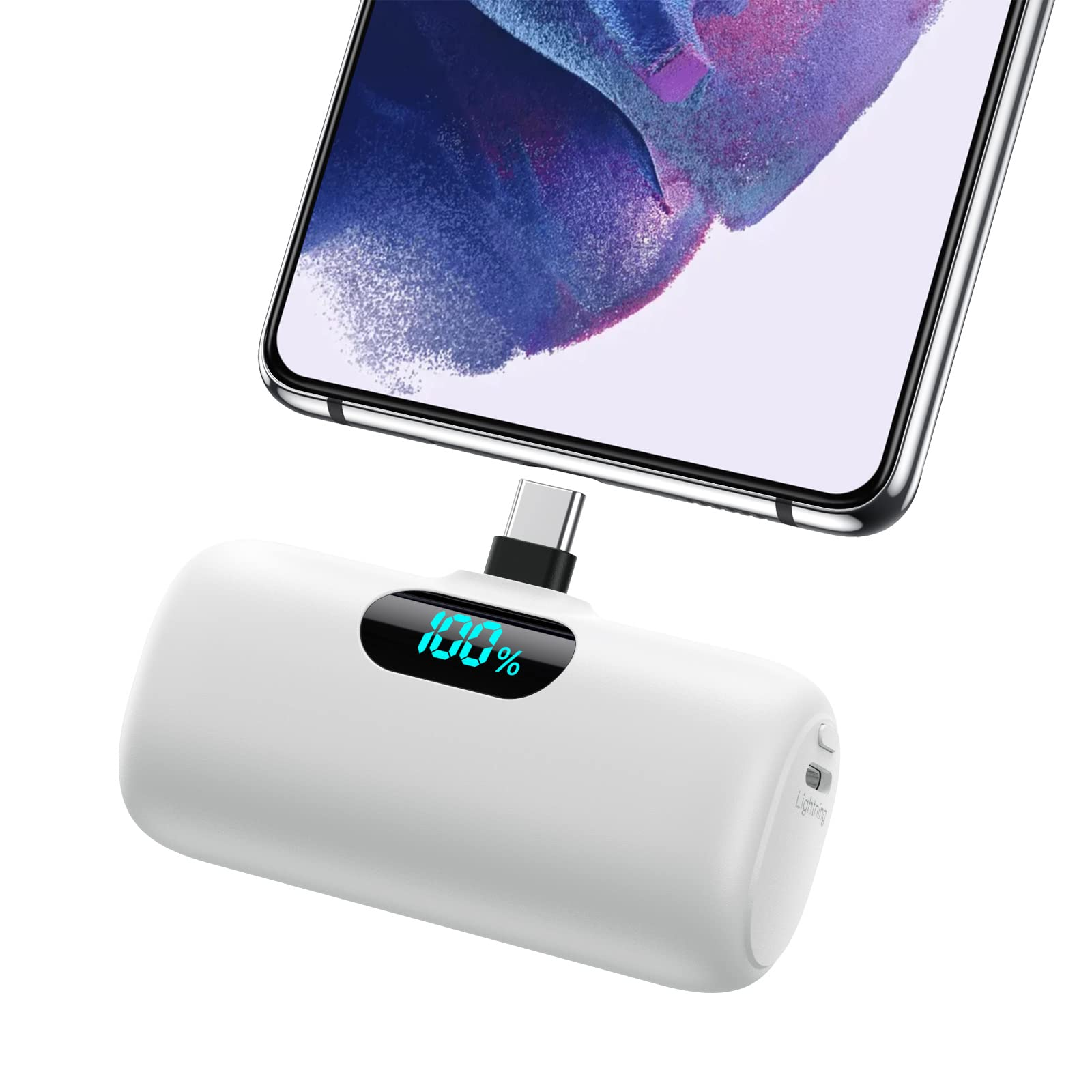 White power bank with digital display connected to a smartphone on a white background