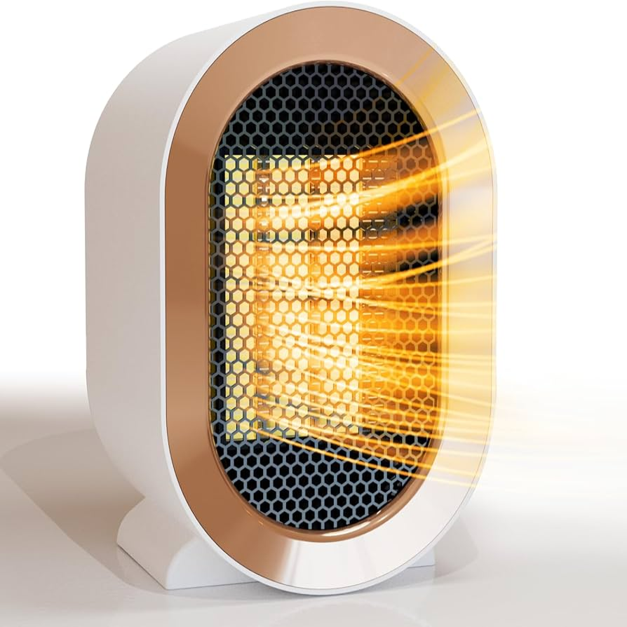 Small electric space heater with visible heat rays on a white background