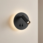 Modern black wall light fixture on a neutral wall