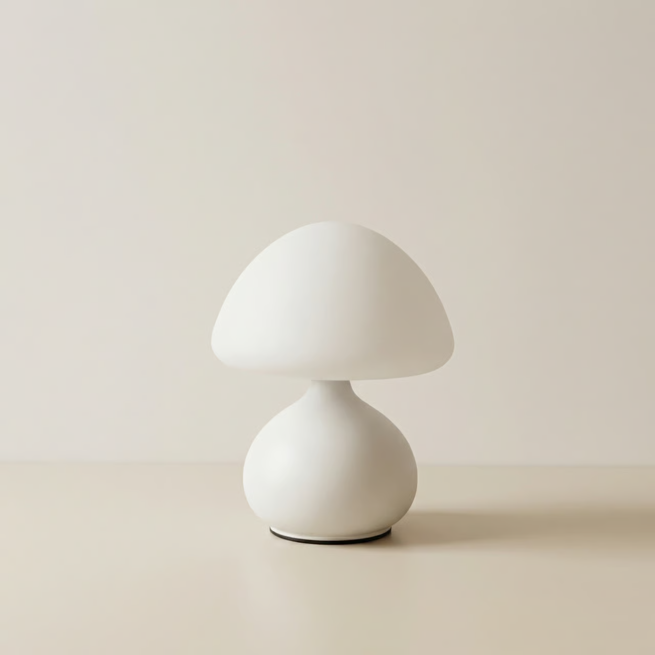 White mushroom-shaped table lamp on a beige background
