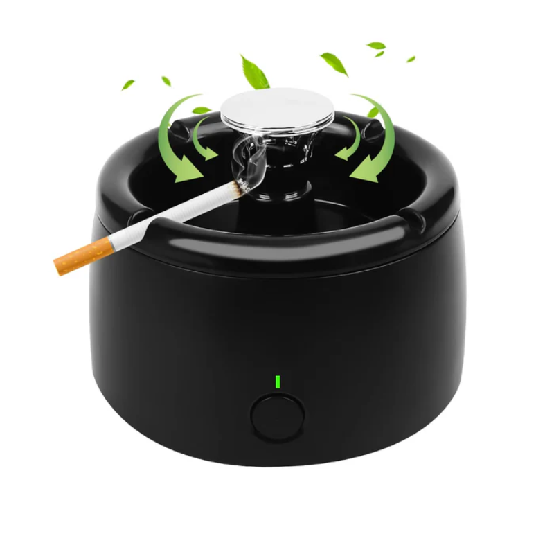 Black ashtray with a smoking cigarette on a white background