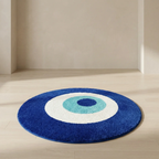 Round blue rug with a white center and blue circle on a wooden floor.