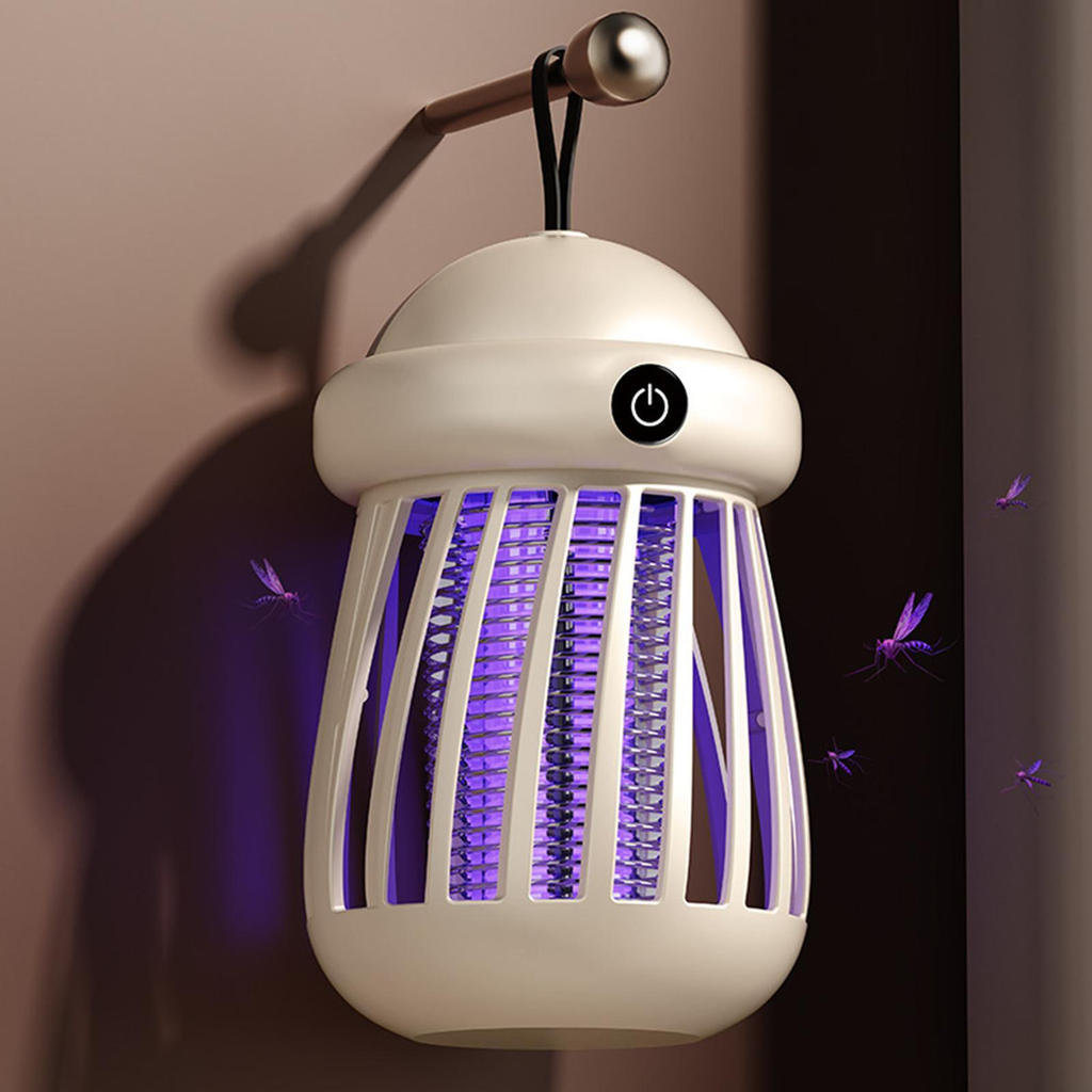 White electronic insect killer with purple light on a dark background