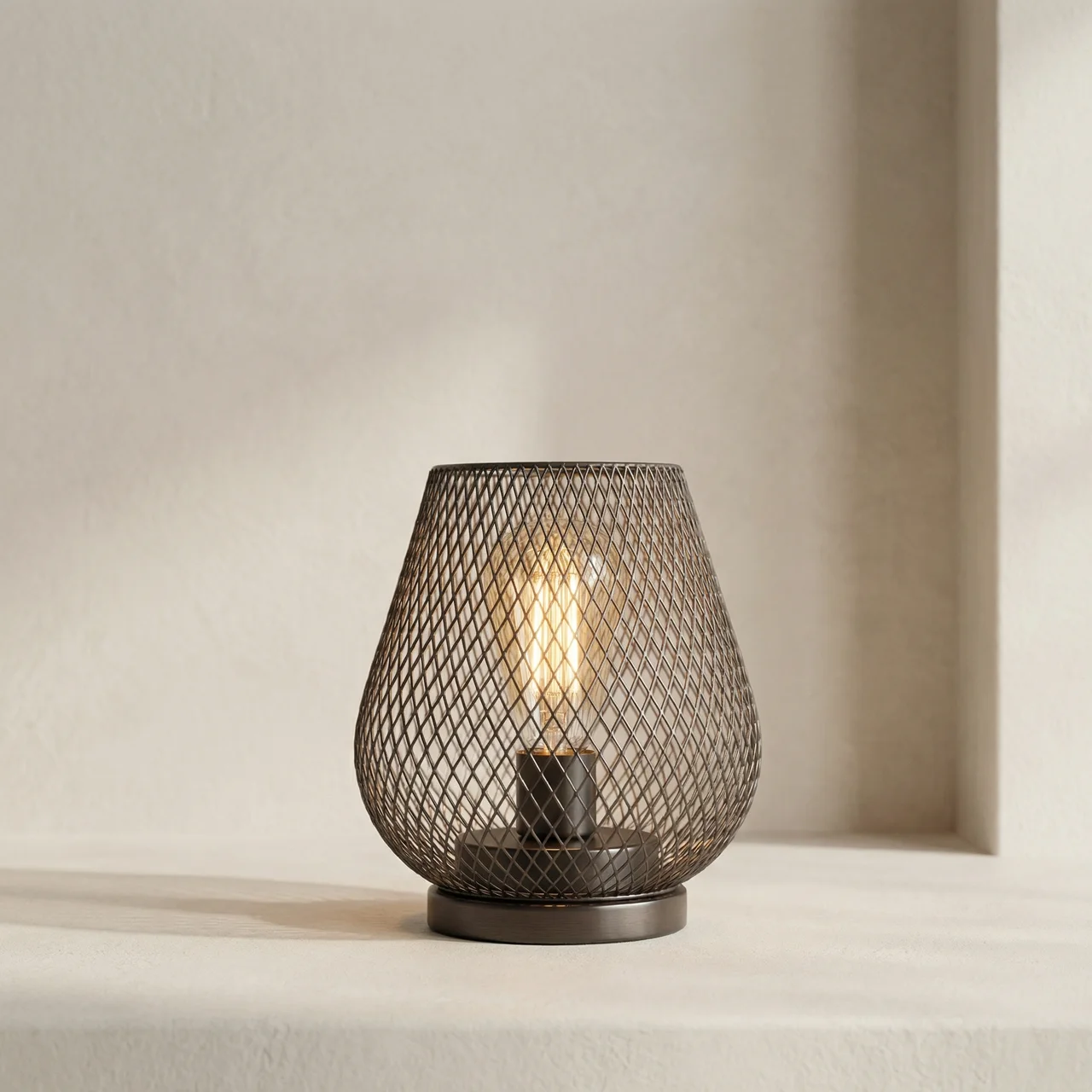 Decorative table lamp with mesh design on a neutral background