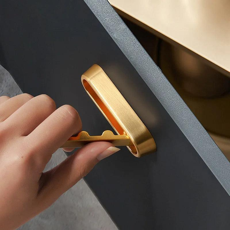 Gold clip being used on a dark surface