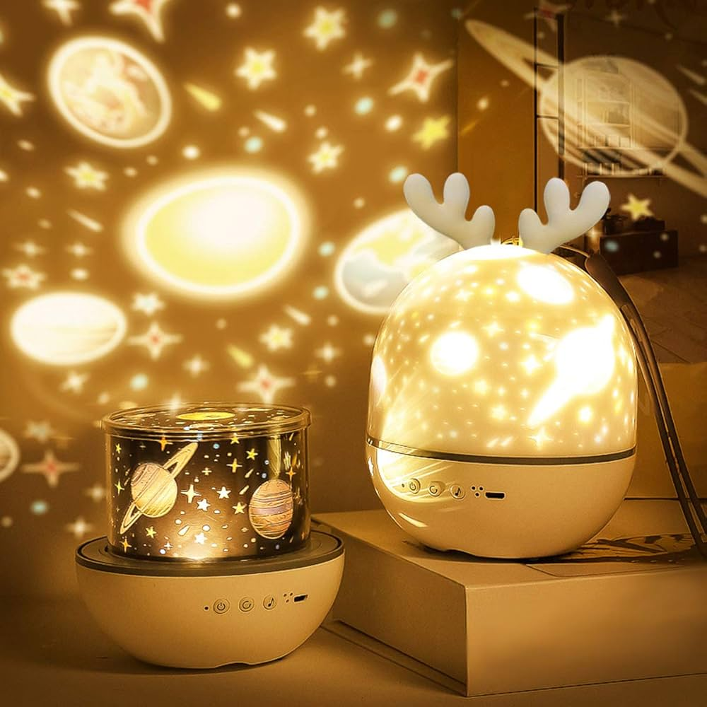 Two decorative night lights with star and planet projections on a surface.