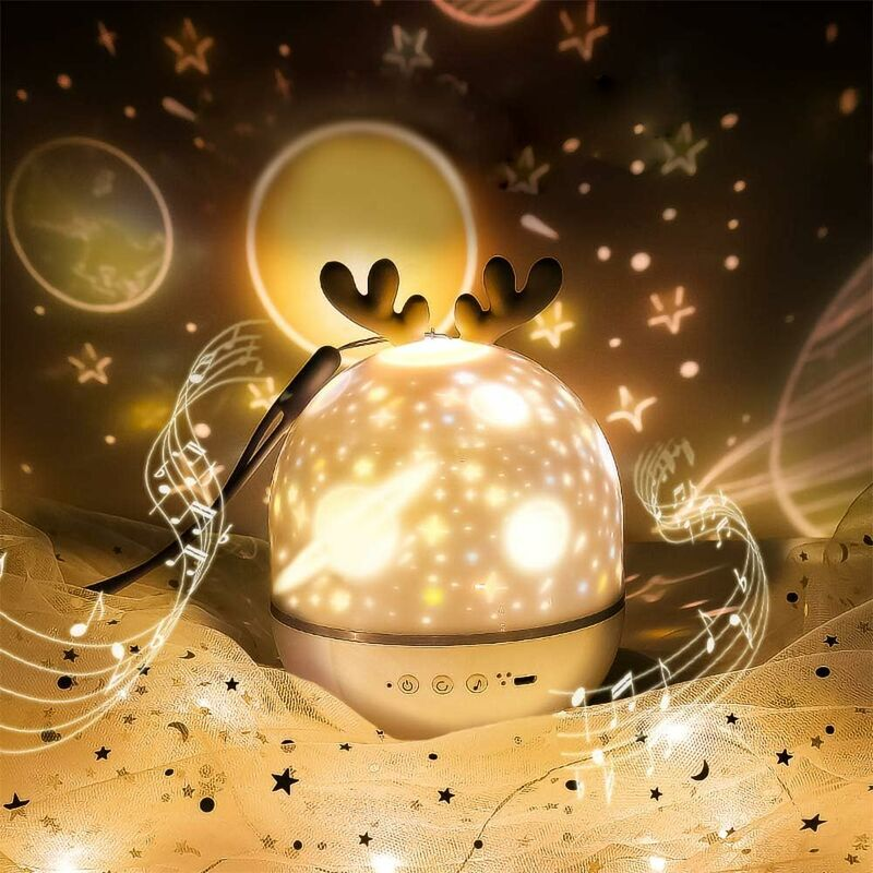 Decorative night light with reindeer antlers on a dark background with star and moon patterns.