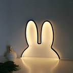 Light-up bunny shape on a white surface with a neutral background