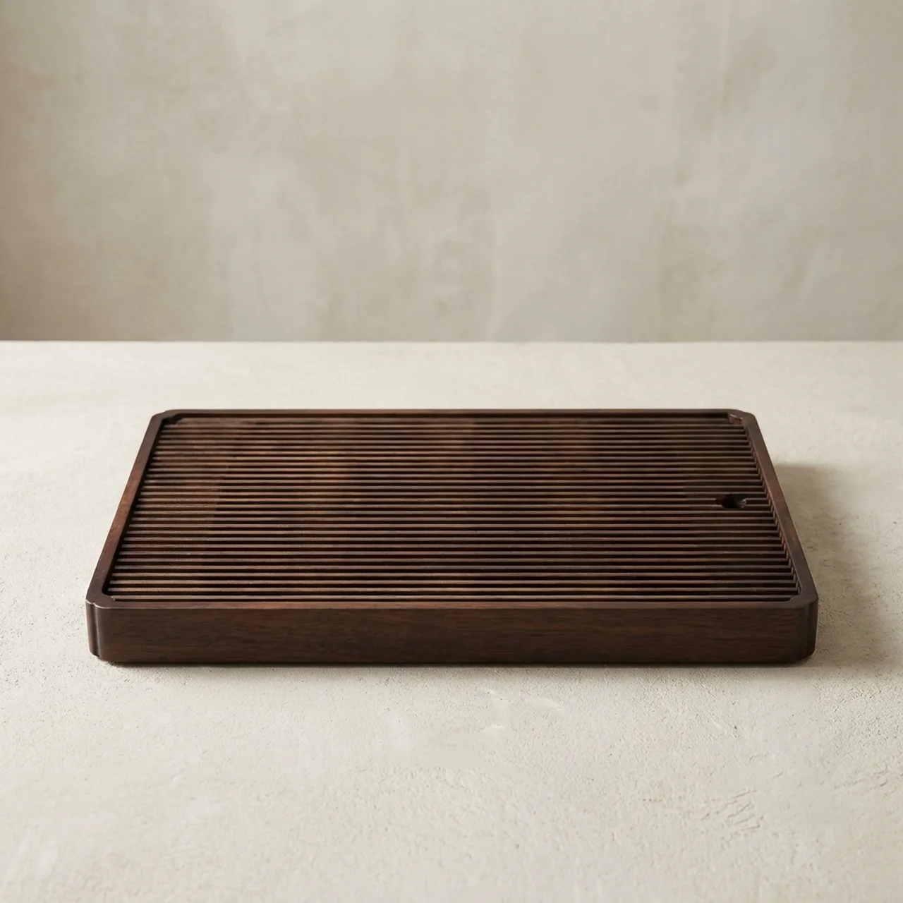 Wooden tray with textured surface on a light background