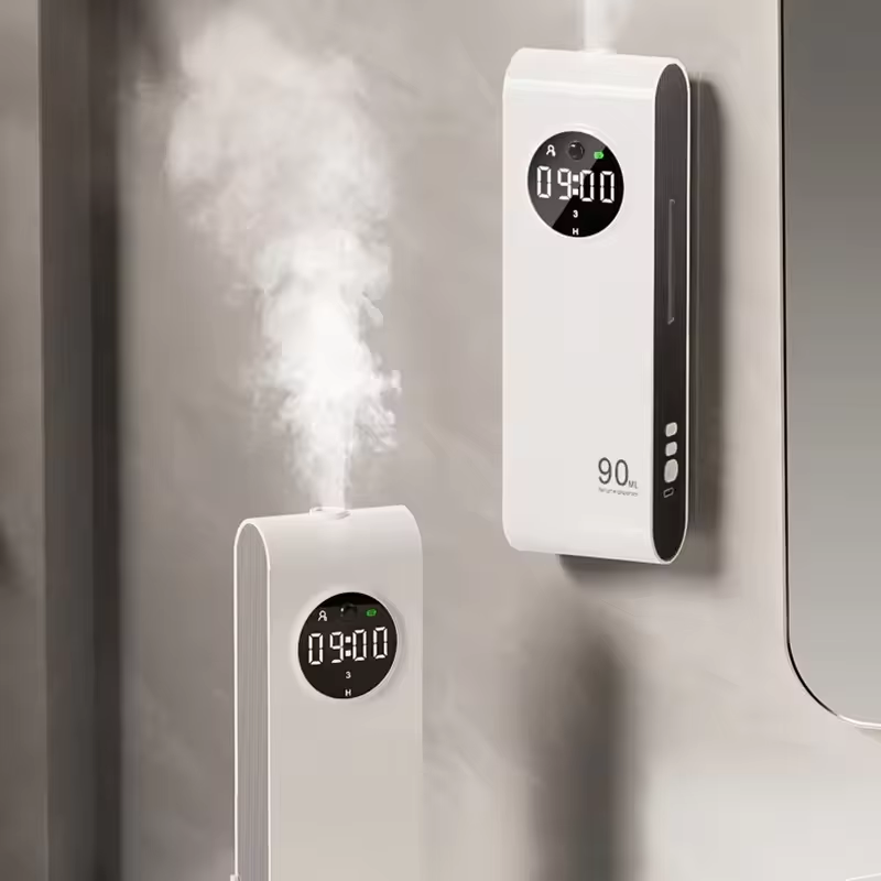 Two white humidifiers with digital displays on a neutral background