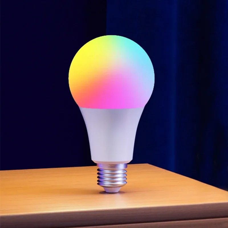Smart light bulb displaying multicolor on a wooden surface with dark background