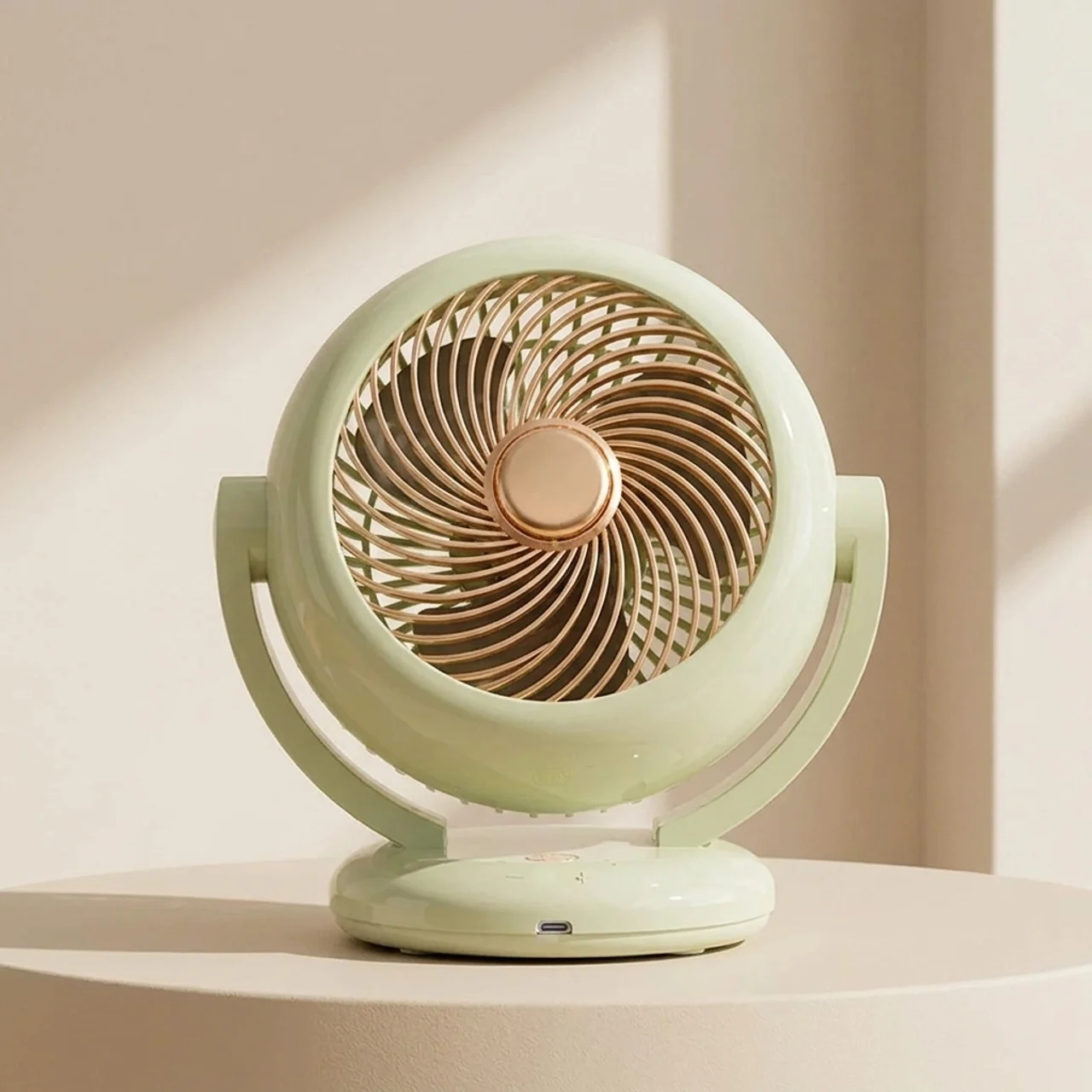 Decorative fan with a gold center on a beige surface