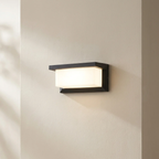 Modern wall-mounted light fixture on a neutral wall