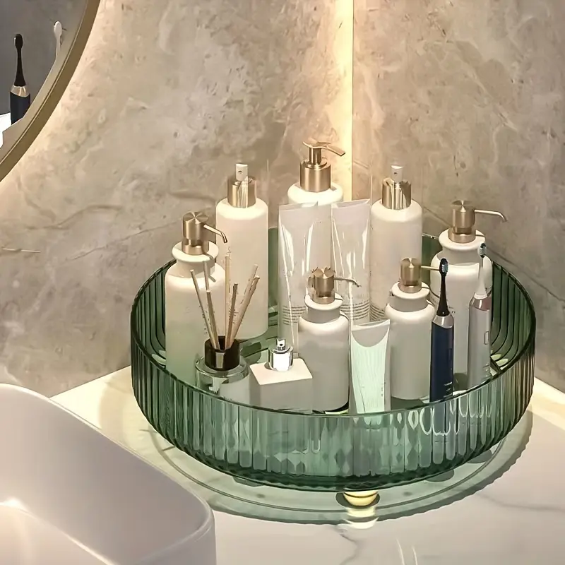 Bathroom vanity with skincare products on a green glass tray