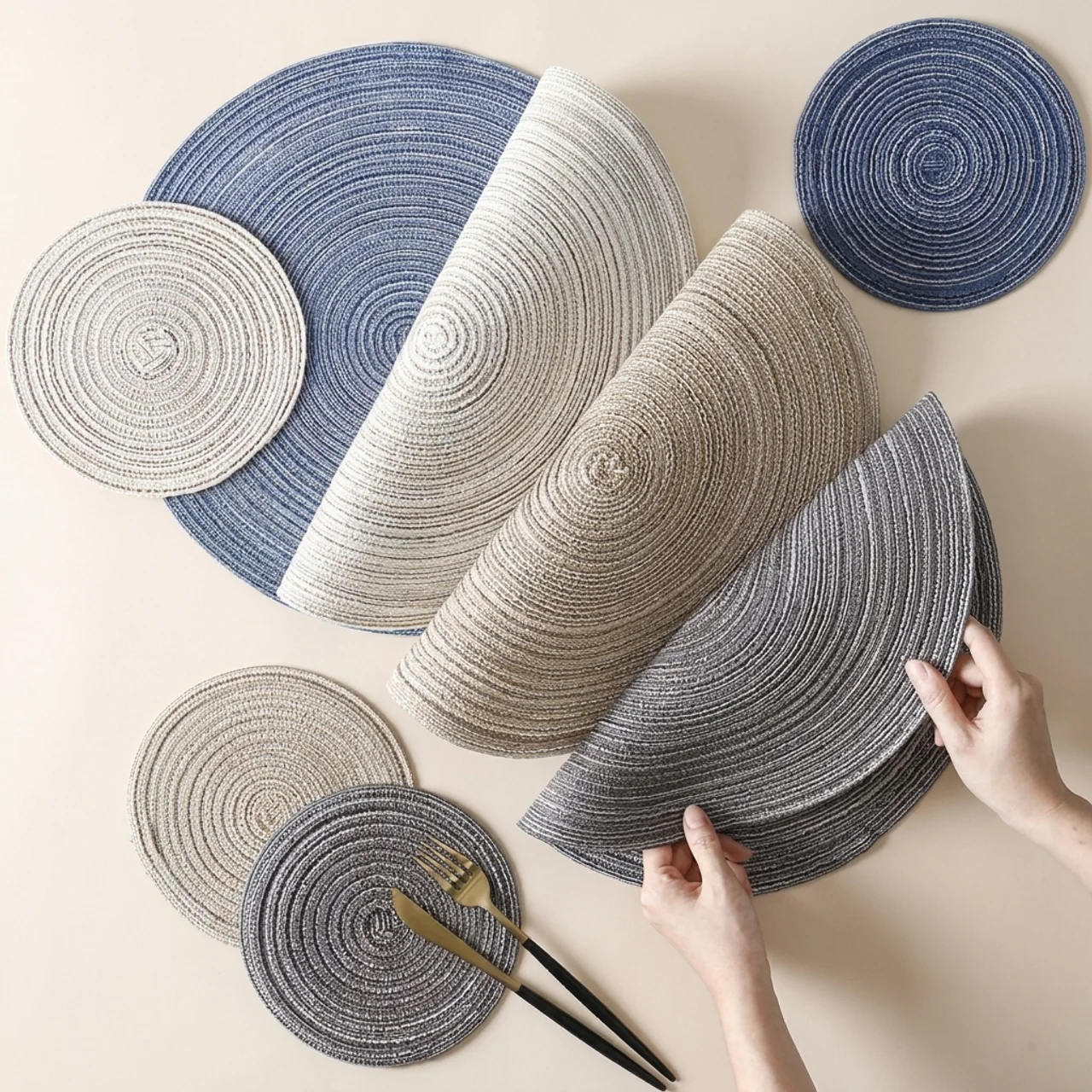 Set of round woven placemats in various colors on a neutral background