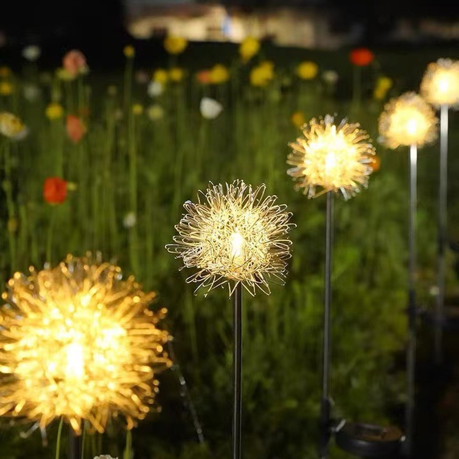 Decorative outdoor lights resembling dandelions in a garden setting.