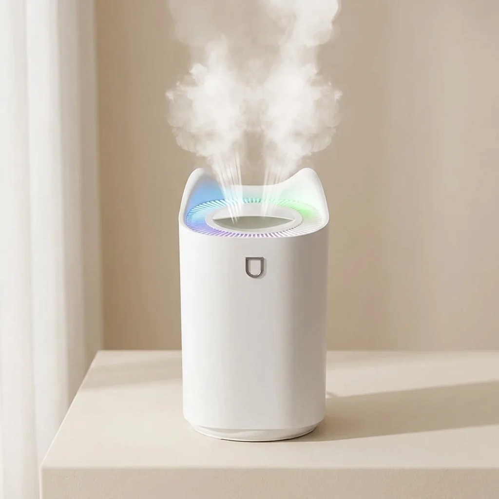 White humidifier emitting mist on a light surface with a neutral background