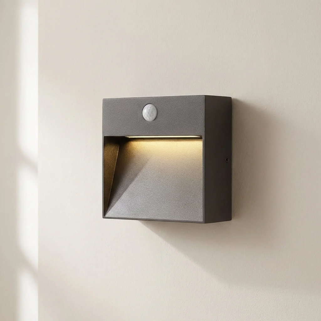 Square outdoor wall light with motion sensor on a beige wall