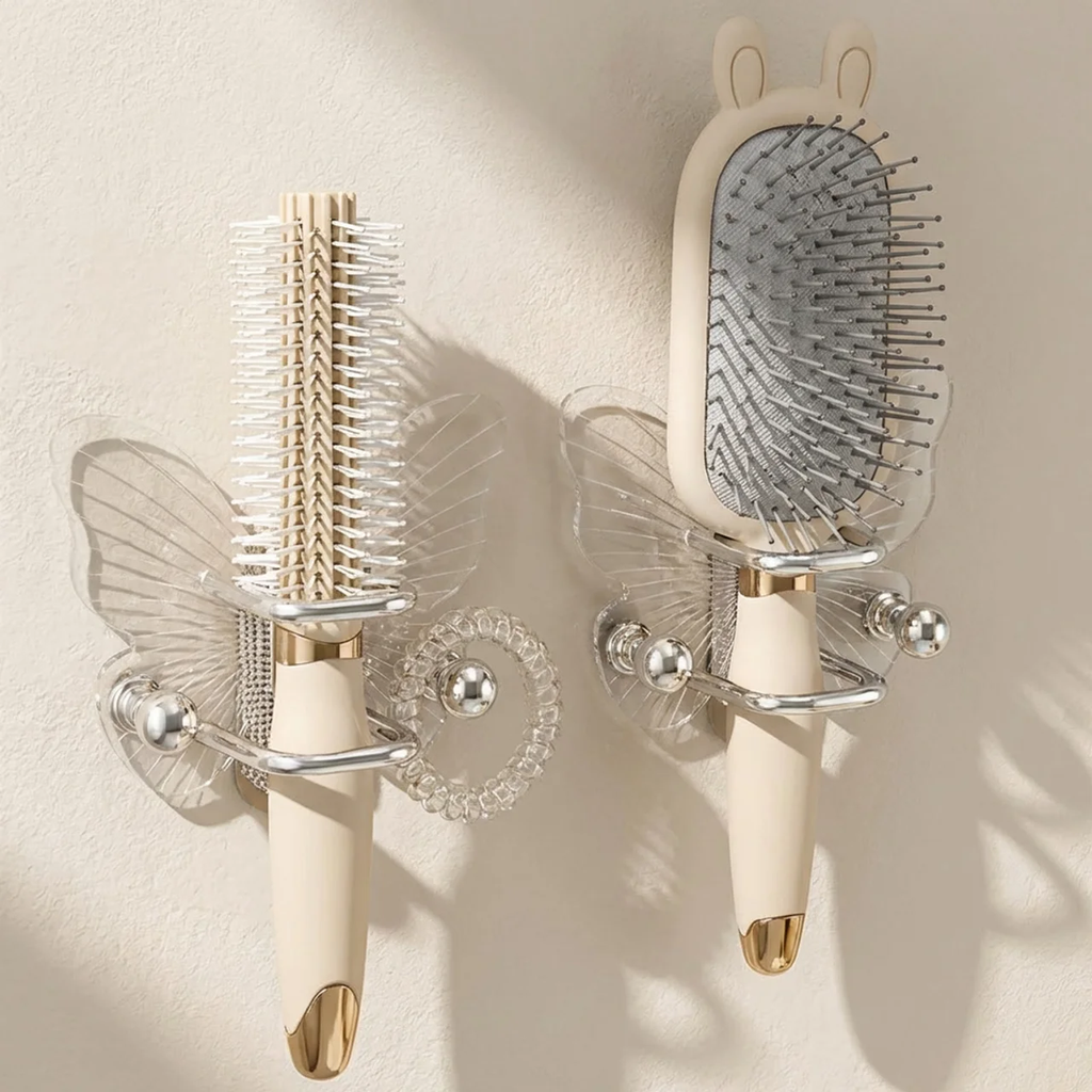 Two decorative wall sconces with gold accents on a beige wall.