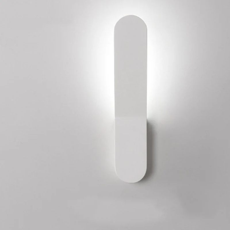 White wall-mounted light fixture on a gray background
