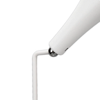 White lamp with a cylindrical shade on a white background